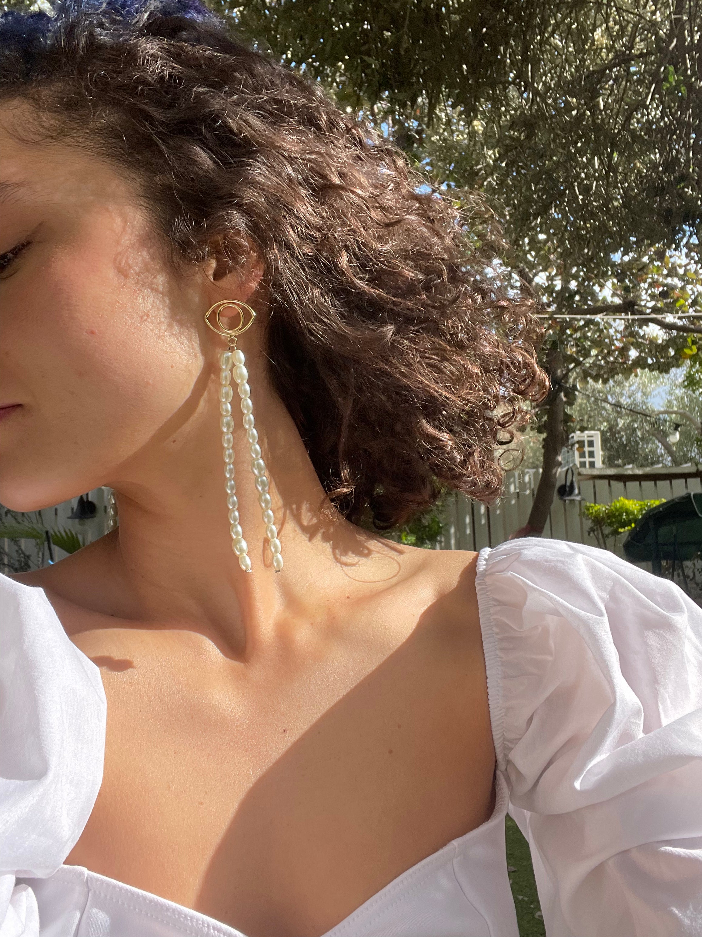 Evil eye earrings with pearls