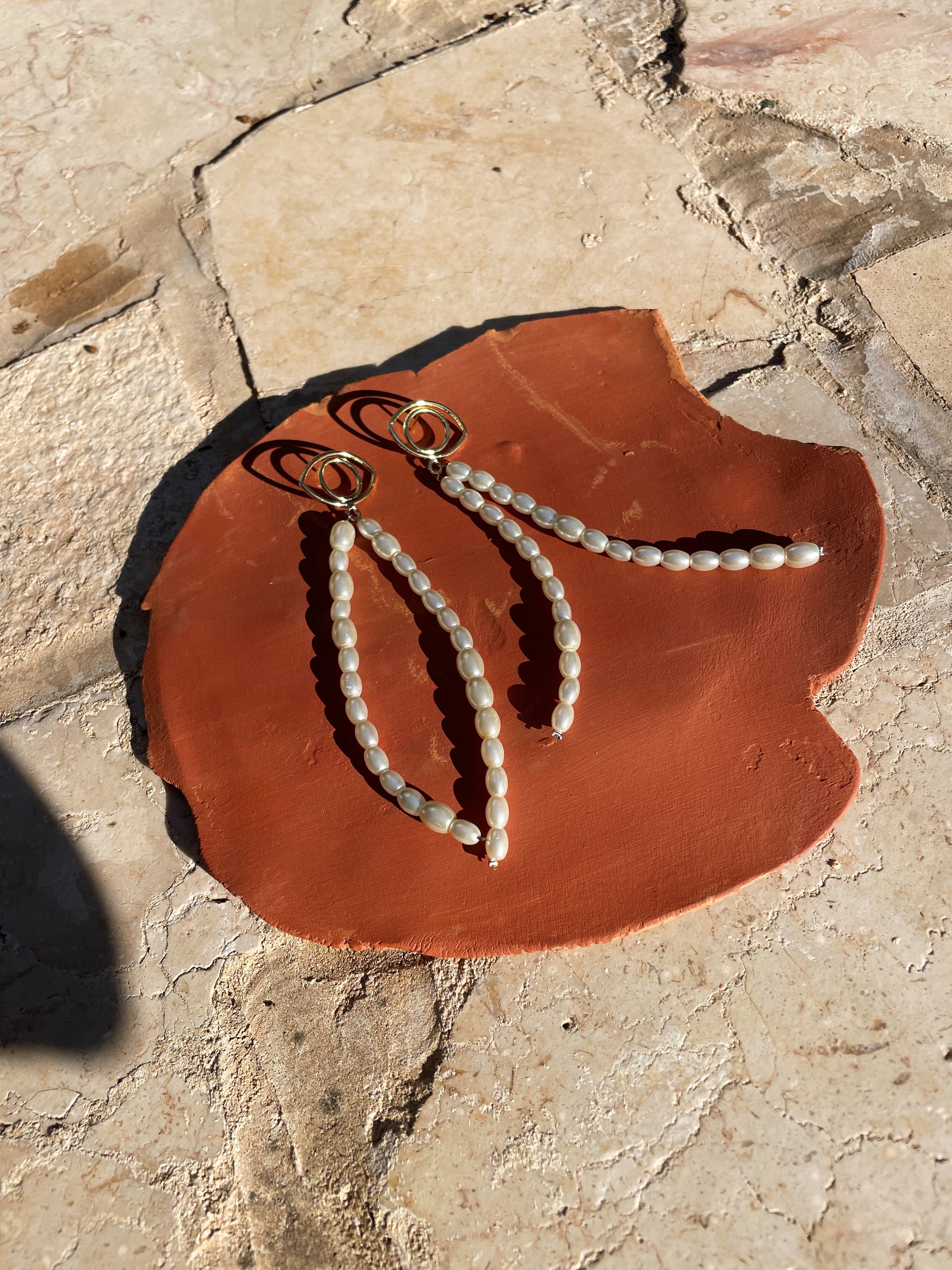 Evil eye earrings with pearls