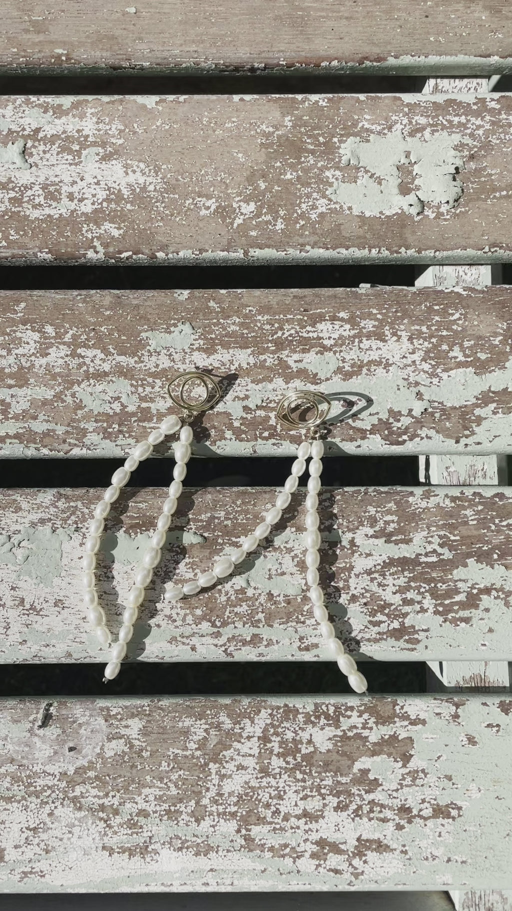 Evil eye earrings with pearls